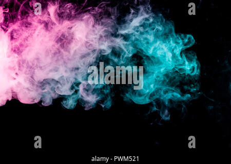Textural background for creativity . Dense multicolored smoke of   blue and pink colors on a black isolated background. Background of smoke vape Stock Photo