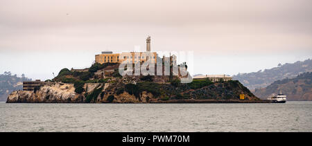 Famed isolated prison Island in the Bay at San Francisco tour boat docked Stock Photo