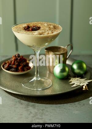 Brandy cream with cinnamon sugar and Christmas pudding crumbs (England) Stock Photo