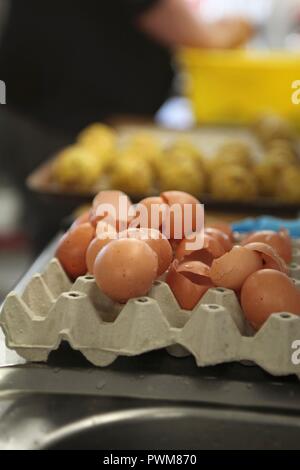 Empty eggshells in an egg box Stock Photo