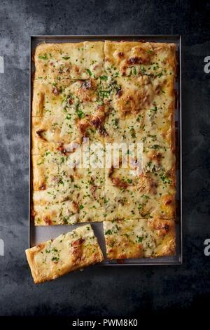 Four-cheese pizza on a baking tray Stock Photo