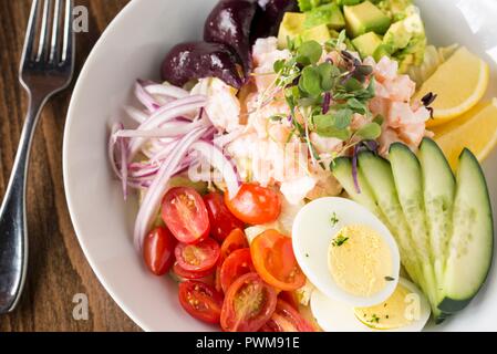 A vegetable salad with shrimps and hard-boiled eggs Stock Photo