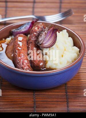 Fried sausages with mashed potatoes and gravy Stock Photo