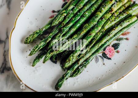 Green asparagus cooking a la plancha Stock Photo