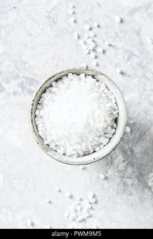 Rock salt in a ceramic bowl Stock Photo