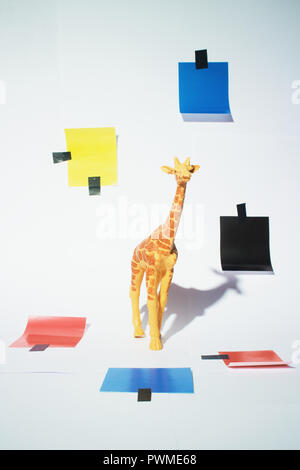 Giraffe toy studio shoot with a piet mondrian inspired decorations Stock Photo