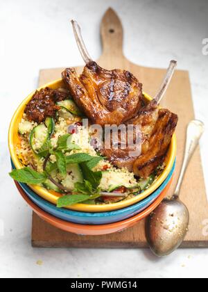 Moroccan lamb chops with couscous and mint Stock Photo