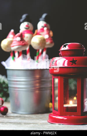 Decorated cake pops on dark background with colorful bokeh background Stock Photo