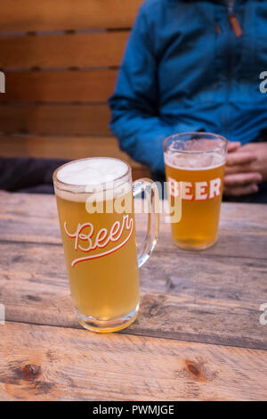 Glasses full of beer at a pub in North London, UK Stock Photo