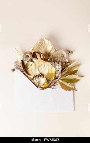 Autumn Composition Template. Golden Leaves in the postal envelope. Fall, autumn concept. Top view picture. Stock Photo