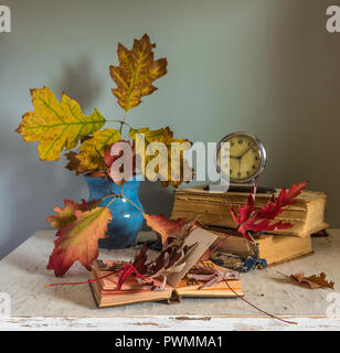 Still life with books and autumn leaves. vintage autumn colors. melancholy. Stock Photo