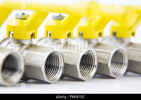 Close up on a particular of a faucet on a white background Stock Photo