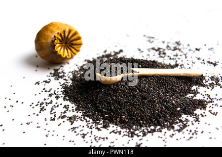 Poppy seeds and pod isolated on white background Stock Photo