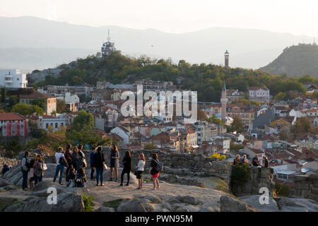 Guided group of tourists on scenic lookout over old town Plovdiv, Bulgaria Stock Photo