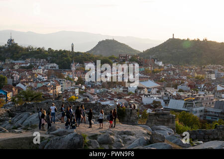 Guided group of tourists on scenic lookout over old town Plovdiv, Bulgaria Stock Photo