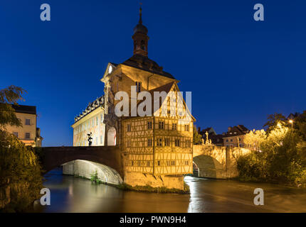 Historic city hall of Bamberg, Bavaria, on the Obere Brücke bridge across Regnitz river at night Stock Photo