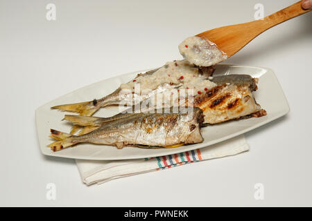 Grilled horse mackerel with almond sauce Stock Photo