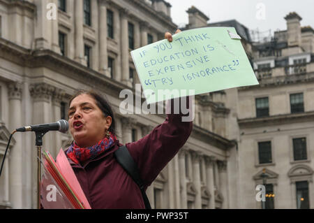 London, UK. 17th October 2018. A woman holds up a poster written by one of her students unable to be present as staff and students from Further Education Colleges across the country meet in Waterloo Place to march to a rally in Parliament Square calling for the vital work that FE Colleges do to be recognised and properly funded. The #Loveourcolleges action called for funding to allow the colleges to do their job properly and to pay teachers on comparable rates to their colleagues in schools and Higher Education. Credit: Peter Marshall/Alamy Live News Stock Photo
