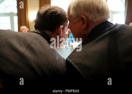 Washington, DC. 17th Oct, 2018. United States Attorney General Jeff Sessions (R) talks with US Secretary of Labor Alex Acosta during a Trump Administration cabinet meeting in the Cabinet Room at the White House October 17, 2018 in Washington, DC. Earlier this week Trump dispatched Secretary of State Mike Pompeo to Saudi Arabia and Turkey to meet with those countries' leaders about the disappearance of Saudi dissident and Washington Post opinion columnist Jamal Khashoggi. Credit: Chip Somodevilla/Pool via CNP | usage worldwide Credit: dpa/Alamy Live News Stock Photo