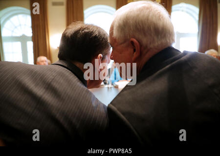 Washington, DC. 17th Oct, 2018. United States Attorney General Jeff Sessions (R) talks with US Secretary of Labor Alex Acosta during a Trump Administration cabinet meeting in the Cabinet Room at the White House October 17, 2018 in Washington, DC. Earlier this week Trump dispatched Secretary of State Mike Pompeo to Saudi Arabia and Turkey to meet with those countries' leaders about the disappearance of Saudi dissident and Washington Post opinion columnist Jamal Khashoggi. Credit: Chip Somodevilla/Pool via CNP | usage worldwide Credit: dpa/Alamy Live News Stock Photo