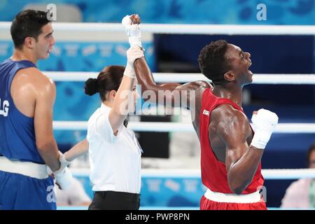 Buenos Aires, Argentina. 17th Oct, 2018. Keno Machado (R) of Brazil celebrates after the Men's Middle (75kg) Gold Medal Bout at the 2018 Summer Youth Olympic Games in Buenos Aires, Argentina, on Oct. 17, 2018. Keno Machado won the gold medal by defeating Farid Douibi with 5-0. Credit: Li Ming/Xinhua/Alamy Live News Stock Photo