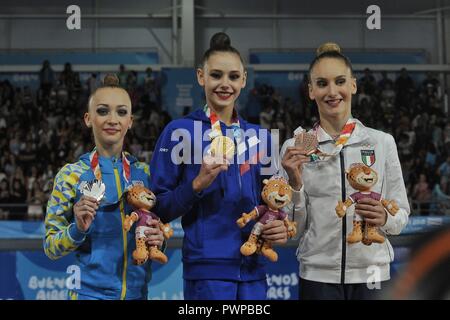 October 16, 2018 - Buenos Aires, Buenos Aires, Argentina - (L-R) Silver medalist KHRYSTYNA POHRANYCHNA of Ukraine, gold medalist DARIA TRUBNIKOVA of Russia and bronze medalist TALISA TORRETI of Italy stand on the podium during the medal ceremony for the Gymnastics Indiviudual All Around on Day 16th of the Buenos Aires 2018 Youth Olympic Games at the Olympic Park. (Credit Image: © Patricio Murphy/ZUMA Wire) Stock Photo