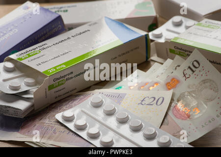 Money Sterling or Euros paid for prescription only medical drugs medicine on black market, illegal to sell pills, capsules, blister packets Stock Photo