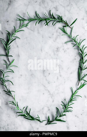 Rosemary frame on marble background Stock Photo