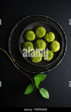 Overhead image of matcha cookies covered with sugar and matcha powder ...