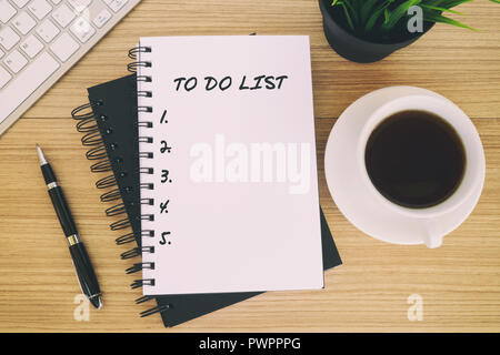 To Do List text on notepad - coffee, pen, computer keyboard Stock Photo