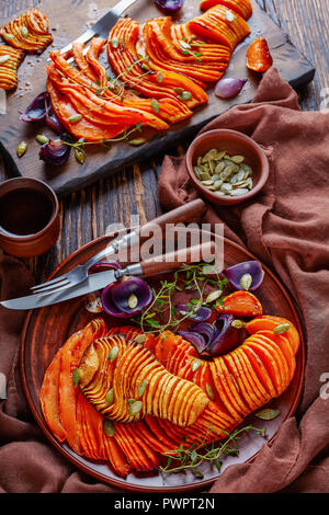 closeup sliced pumpkin on old wooden background Stock Photo - Alamy