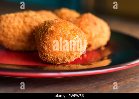 Freshly cooked breaded meat cutlets on plate Stock Photo