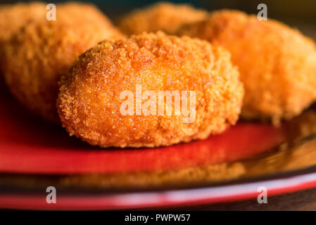 Freshly cooked breaded meat cutlets on plate Stock Photo