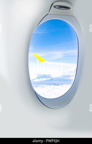 Aircraft illuminator view, Classic image through aircraft window onto jet engine Stock Photo