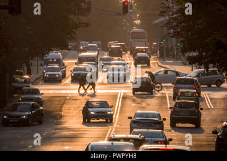 Pedestrians and traffic at sunset in Burgas, Bulgaria Stock Photo