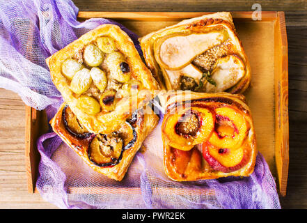 Baked fruit sweet pie slices on a tray Stock Photo