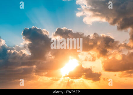 sunset sky - sun shining through clouds scenic sky  - Stock Photo