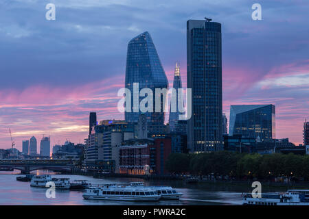 Sunrise over the river Thames at London from Waterloo bridge, with the shard, south bank tower, the vase, and the walkie talkie skyscrapers Stock Photo