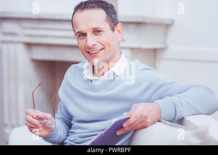 Portrait of optimistic manager with a clipboard Stock Photo