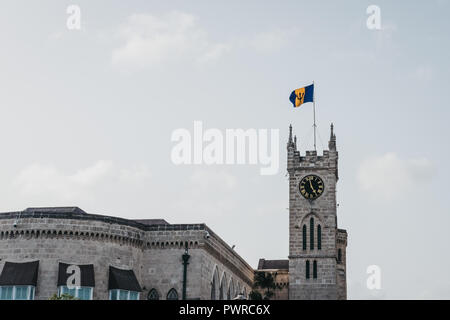 Bridgetown, Barbados - June 26, 2018: Barbados flag on top of the Parliament Building and Museum in Bridgetown, the capital of Barbados and a port cit Stock Photo