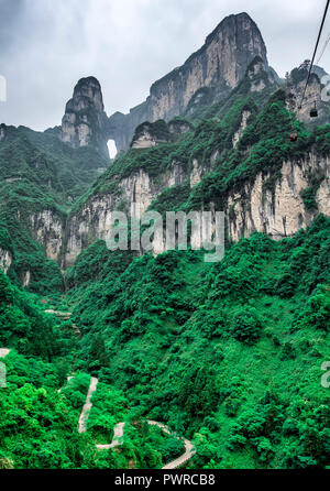 The longest cableway in the world, landscape view with mountains, peaks and the Haven's Gate Cave within the mist - Tianmen Mountain, The Heaven's Gat Stock Photo
