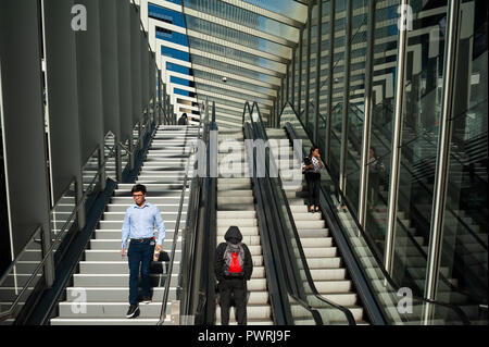 17.09.2018, Sydney, New South Wales, Australia - People are seen standing on an escalator that leads to the sheltered Barangaroo Pedestrian Bridge. Stock Photo