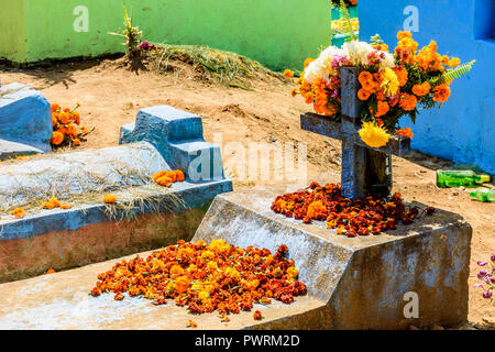 Grave decorated with flowers for All Saints Day on November 1 in Guatemala. Stock Photo