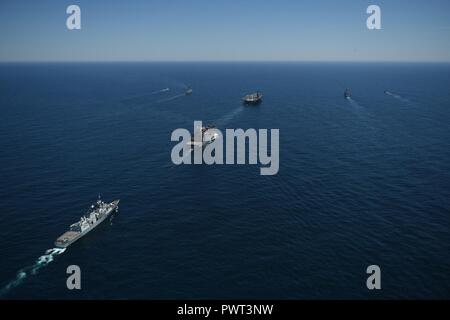 ATLANTIC OCEAN (June 27, 2017) The aircraft carrier USS Dwight D. Eisenhower (CVN 69), the Arleigh Burke-class guided-missile destroyer USS Winston S. Churchill (DDG 81), the guided-missile cruiser USS San Jacinto (CG 56), the Military Sealift Command dry cargo and ammunition ship USNS Robert E. Perry (T-AKE 5), the Royal Canadian Navy frigate HMCS Charlottetown (FFH 339), the Royal Canadian Navy Kingston-class maritime coastal defense vessel HMCS Glace Bay (MM 701) and the Royal Canadian Navy Kingston-class maritime coastal defense vessel HMCS Moncton (MM 708) transit the Atlantic Ocean. The  Stock Photo