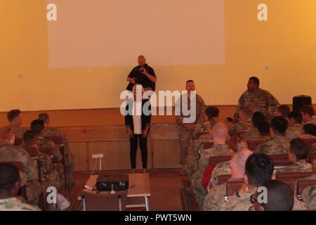 Sony Senior Vice President, Rana Matthes, addresses Battle Group Poland soldiers prior to an advance screening of the new Spiderman Homecoming movie exclusively for the soldiers at Bemowo Piskie Training Area June 30.  The unique, multinational formation of U.S., U.K. and Romanian soldiers serve with the Polish 15th Mechanized Brigade as a deterrence force in northeast Poland in support of NATO’s Enhanced Forward Presence. Stock Photo