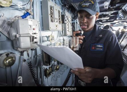 HAIFA, Israel (July 1, 2017) Boatswain's Mate 3rd Class Rajia Christian passes word over the 1-MC while standing watch on the bridge aboard the aircraft carrier USS George H.W. Bush (CVN 77) as the ship prepares to anchor in Haifa, Israel. The ship and its carrier strike group are conducting naval operations in the U.S. 6th Fleet area of operations in support of U.S. national security interests in Europe and Africa. ( Stock Photo