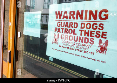 London England,UK,Southwark,storefront window,sign,warning,security guard dogs patrol,UK GB English Europe,UK180820130 Stock Photo