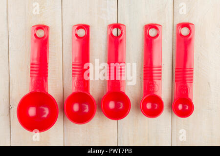 set of measuring spoons on wooden background Stock Photo