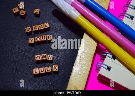 Make your own luck message written on wooden blocks. Motivation concepts. Cross processed image Stock Photo