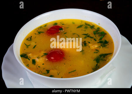 Fish soup with salmon and tomato - Uha Stock Photo